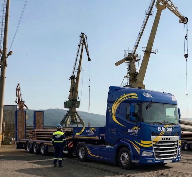 Truck loading pipes in port
